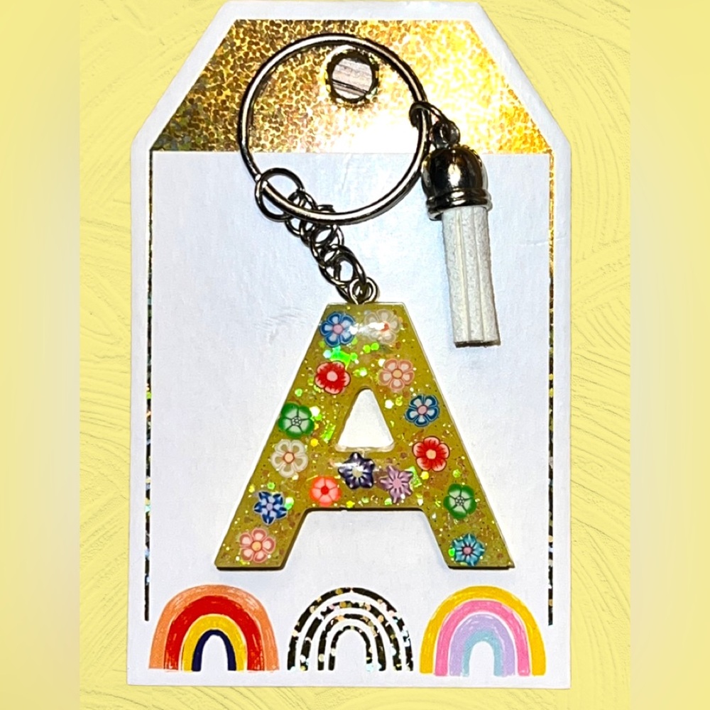 Resin keychain letter A, floral embellishment, white tassel‎